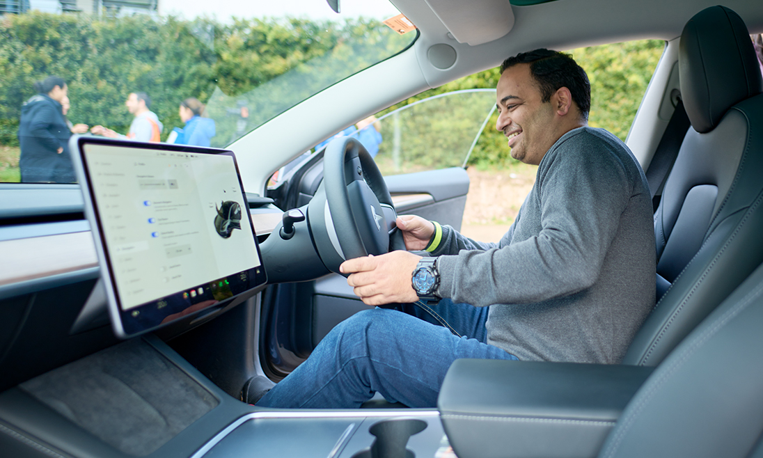 Man test driving an electric vehicle