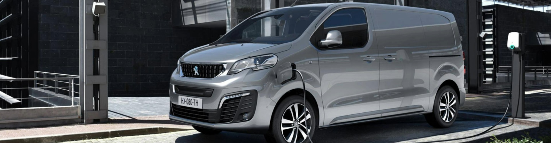 Side-angle view of a grey Peugeot.