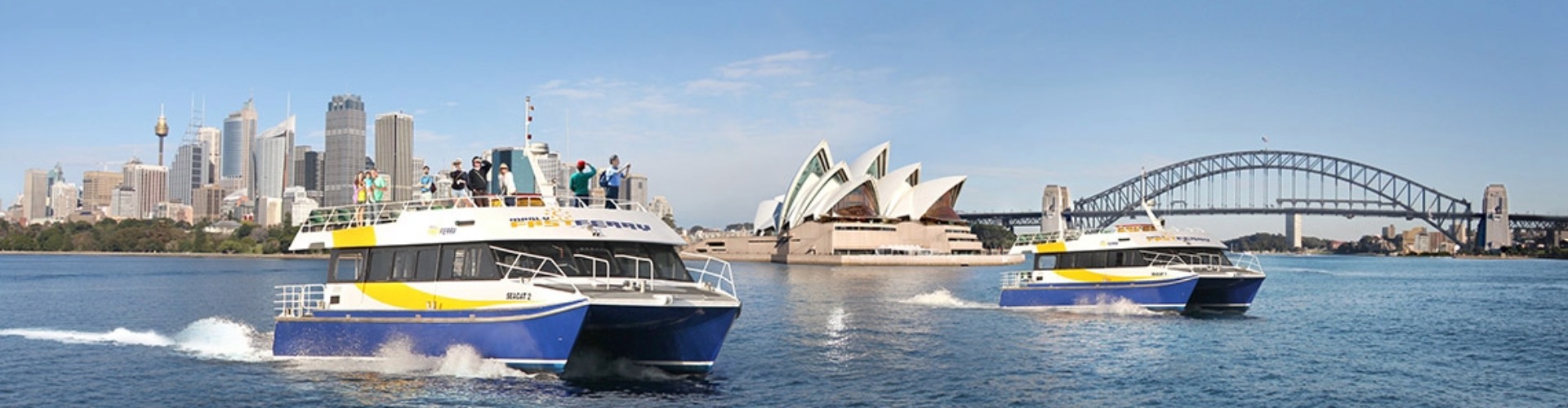 Manly Fast Ferry manly fast ferry crossing Sydney harbour with the opera house and harbour bridge in the background