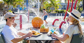 NRMA Treasure Island Holiday Park couple by waterpark