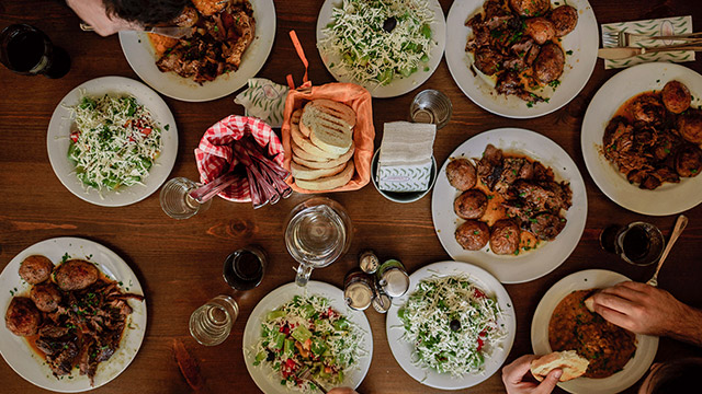 Dining table full of food