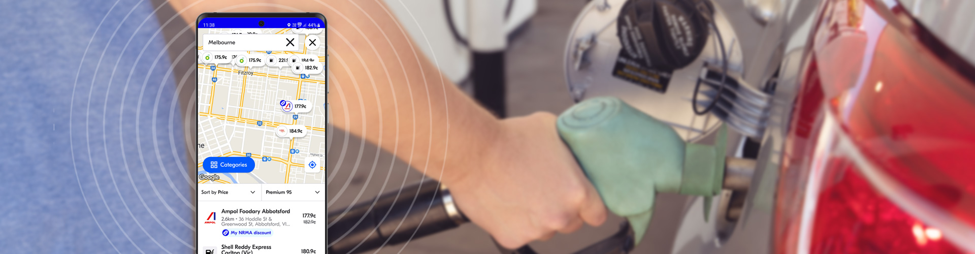 image of mobile phone with fuel app open in foreground with blurred image of person filling up their car with petrol in the background