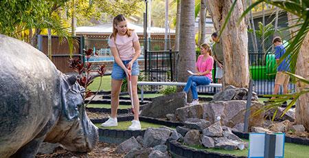 Children playing mini golf, Blue Dolphin