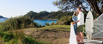 Couple overlooking water at Murramarang