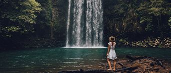 Women by waterfall at Atherton Tablelands
