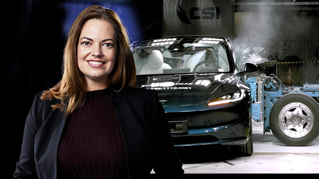 A woman standing in front of a crash test