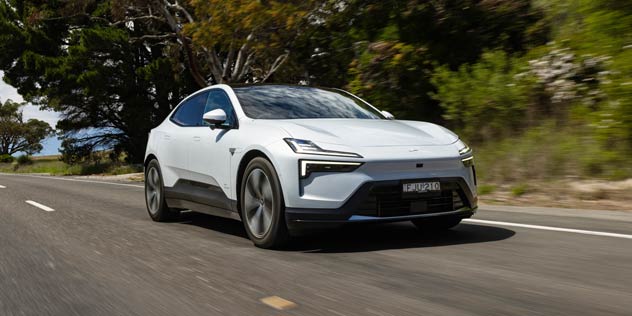A white Polestar 4 on a road
