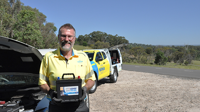 An NRMA patrol holding a car battery
