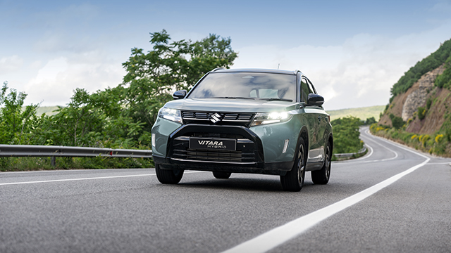Suzuki Vitara Hybrid driving on a road