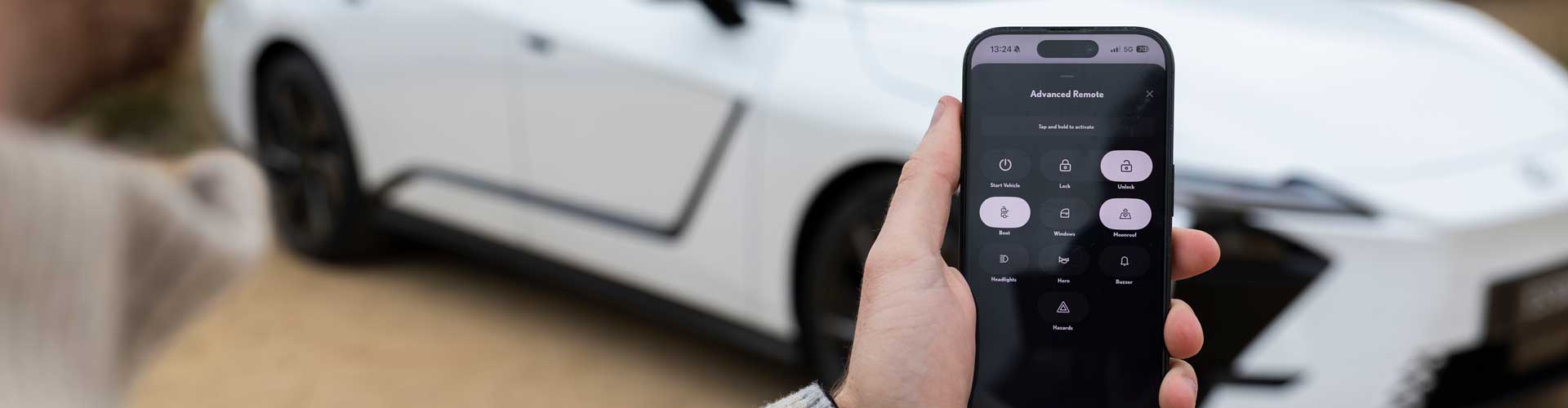 A smartphone in front of a car