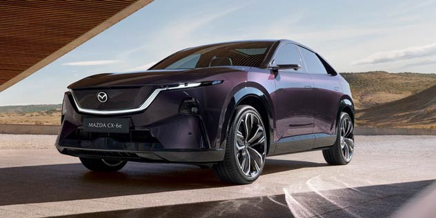 Blkac Mazda SUV driving