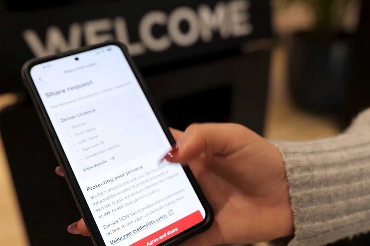 Hand holding phone with privacy message showing