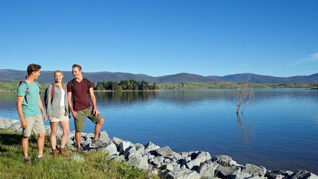 Friends enjoying a scenic hike around Lake Jindabyne in the Snowy Mountains.