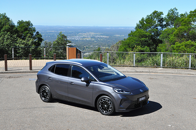 A grey car parked near a lookout