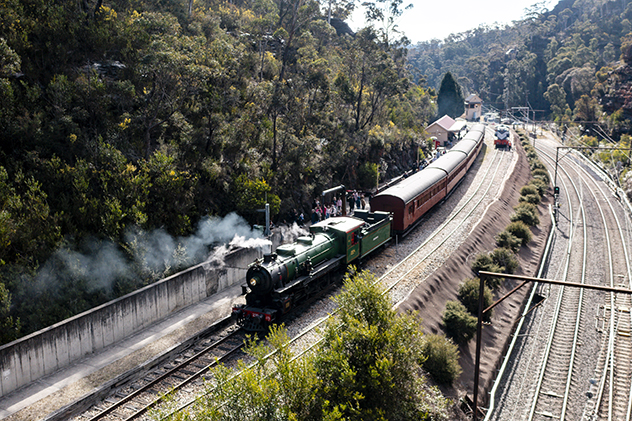 An old steam train on railway tracks