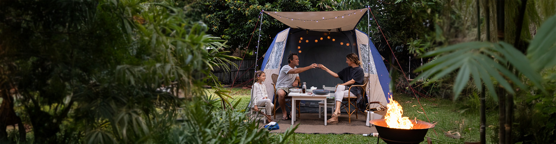 Family camping in the backyard