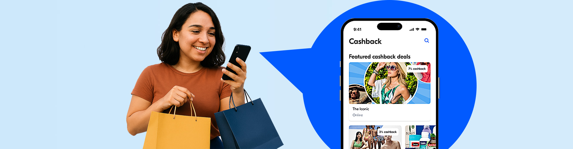 a woman looking at her phone and holding shopping bags