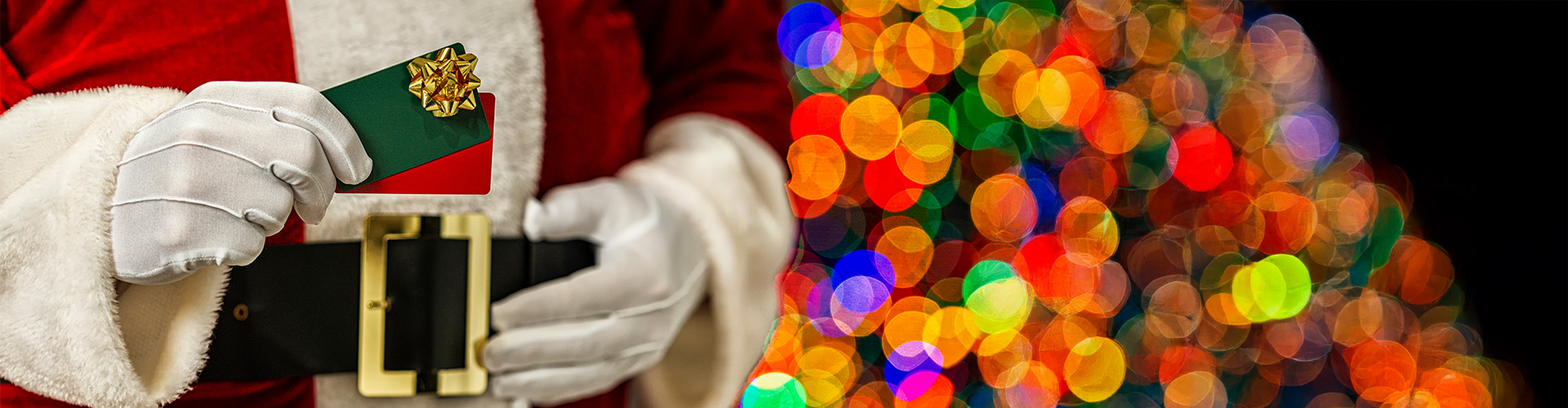 Santa holding gift cards