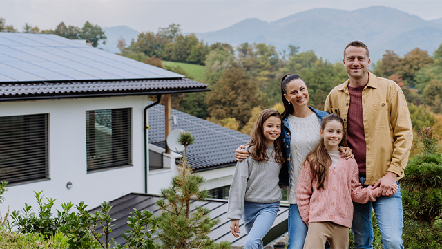 A family standing outside their house