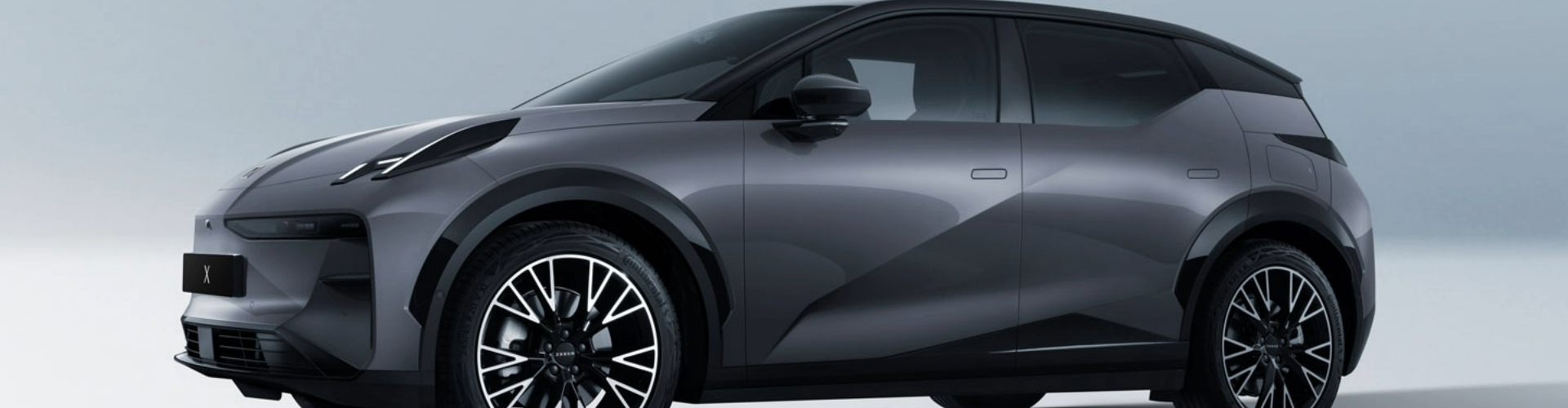 Side view of a charcoal grey 2024 Zeekr X.