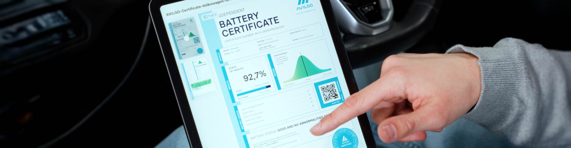 A finger pointing at Aviloo EV battery health app