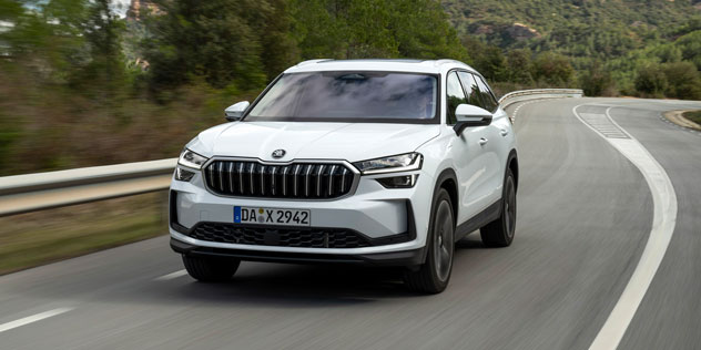 Skoda Kodiaq PHEV driving in front of a mountain