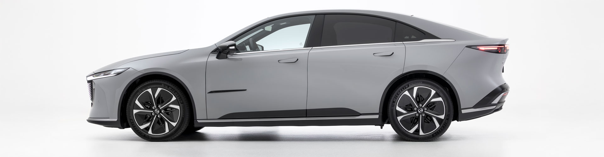 Side view of white Mazda 6e