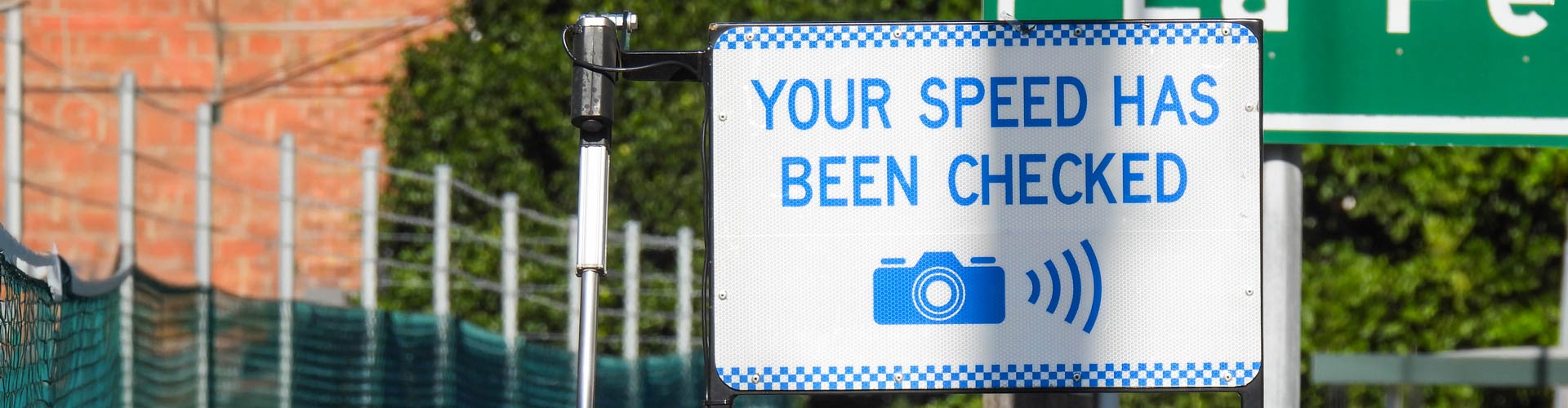 Blue and white "Your speed has been checked" sign in NSW