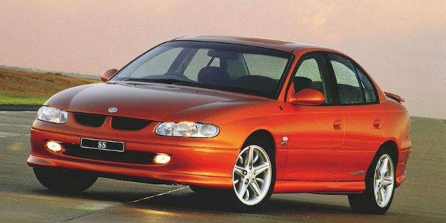 Front angle view of an orange 1997 Holden VT Commodore.