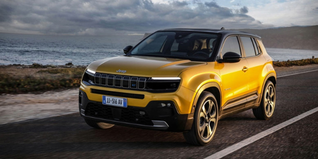 A 2024 Jeep Avenger drives along a seaside road