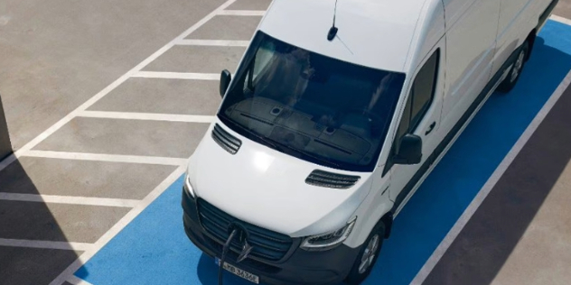 A white 2024 Mercedes-Benz e-Sprinter in a sunlit parking bay