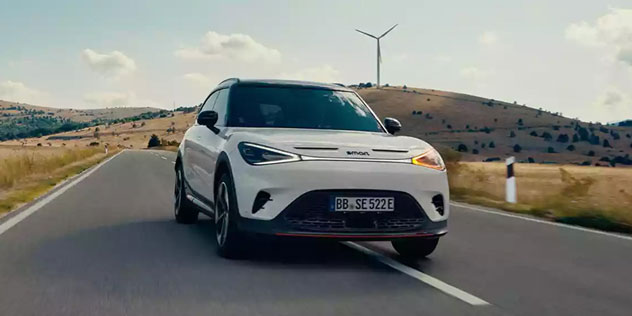 A 2024 Smart #1 driving on a freeway