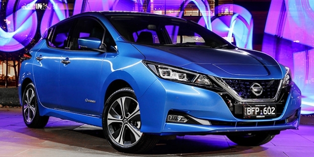 A metallic blue Nissan Leaf