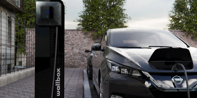 A Nissan leaf plugged into a public charger