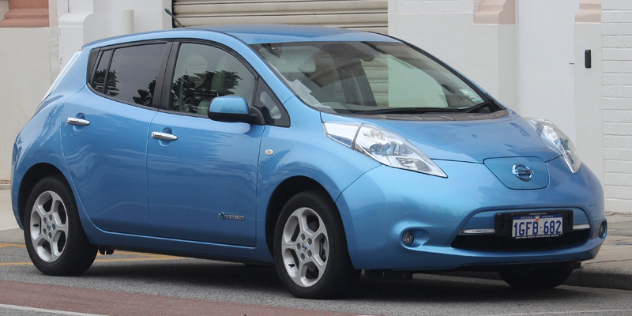 A metallic blue Nissan Leaf parked on the street