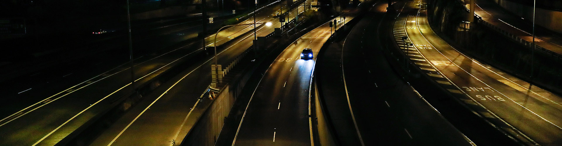Car on empty highway at night