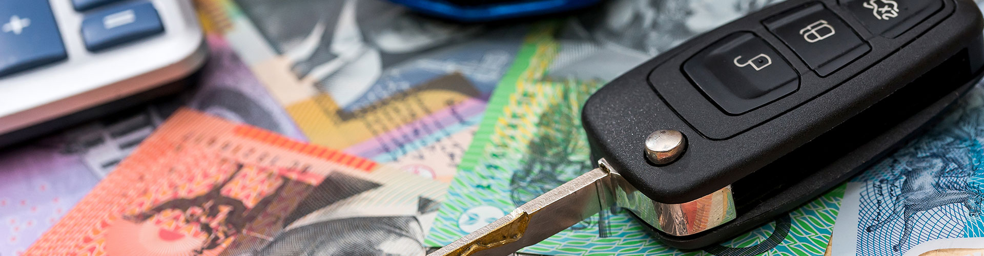 Car key on Australian money with calculator