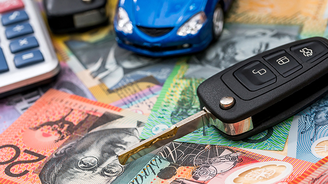 Car key on Australian money with calculator