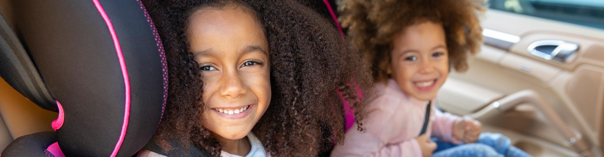 Two girls in car seats