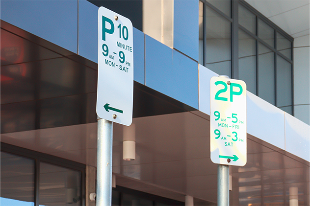 Parking signs with times and days