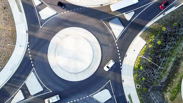 Aerial view of cars entering a roundabout