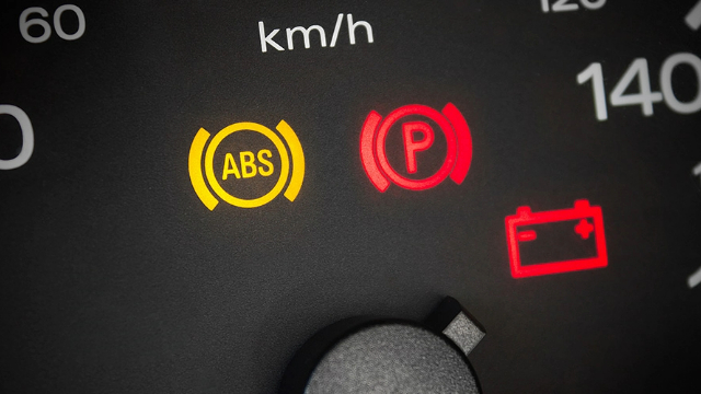 Close-up image of a car's dashboard warning lights Close-up image of a car's dashboard warning lights
