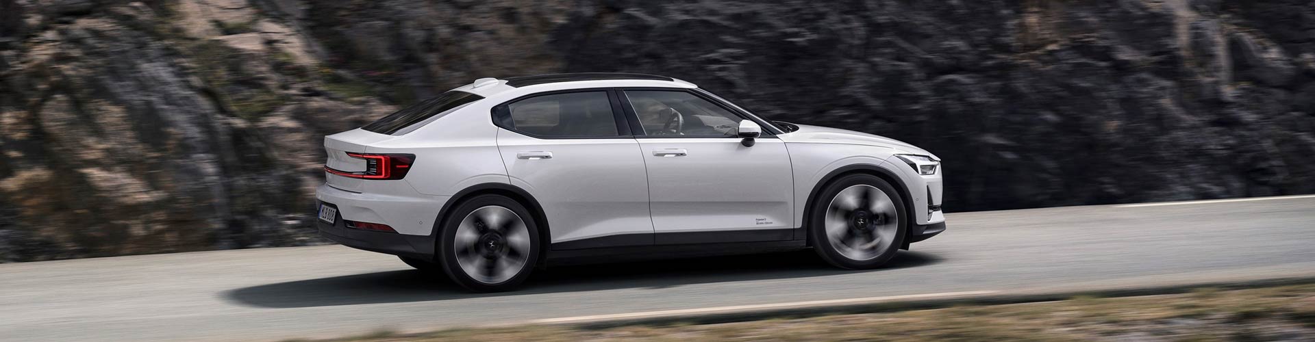 2024 Polestar 2 driving on a road in the mountains