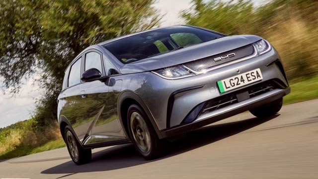 BYD Dolphin hatchback driving on country road