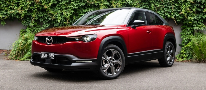 Front-angle view of a red Mazda MX 30.