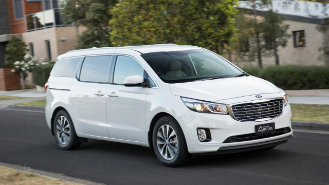 White family wagon on a suburban street