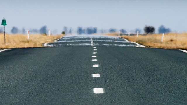 Haze shimmering over a hot country road Haze shimmering over a hot country road