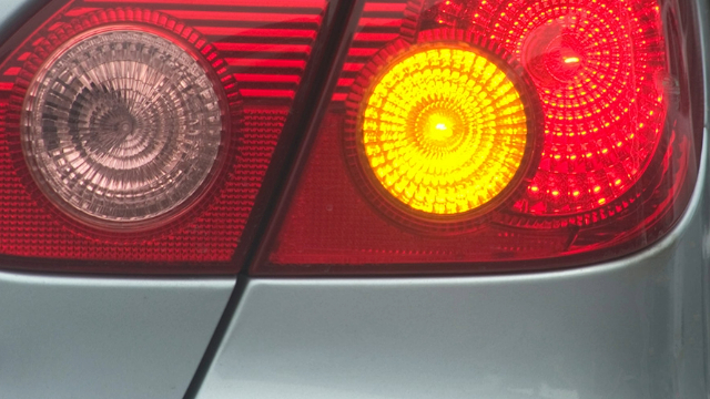 Close-up of a right rear indicator light flashing