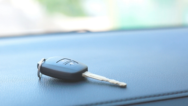 Car key on a car dashboard