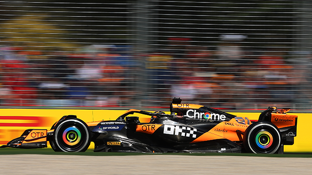 An F1 car driving fast with a blurred background